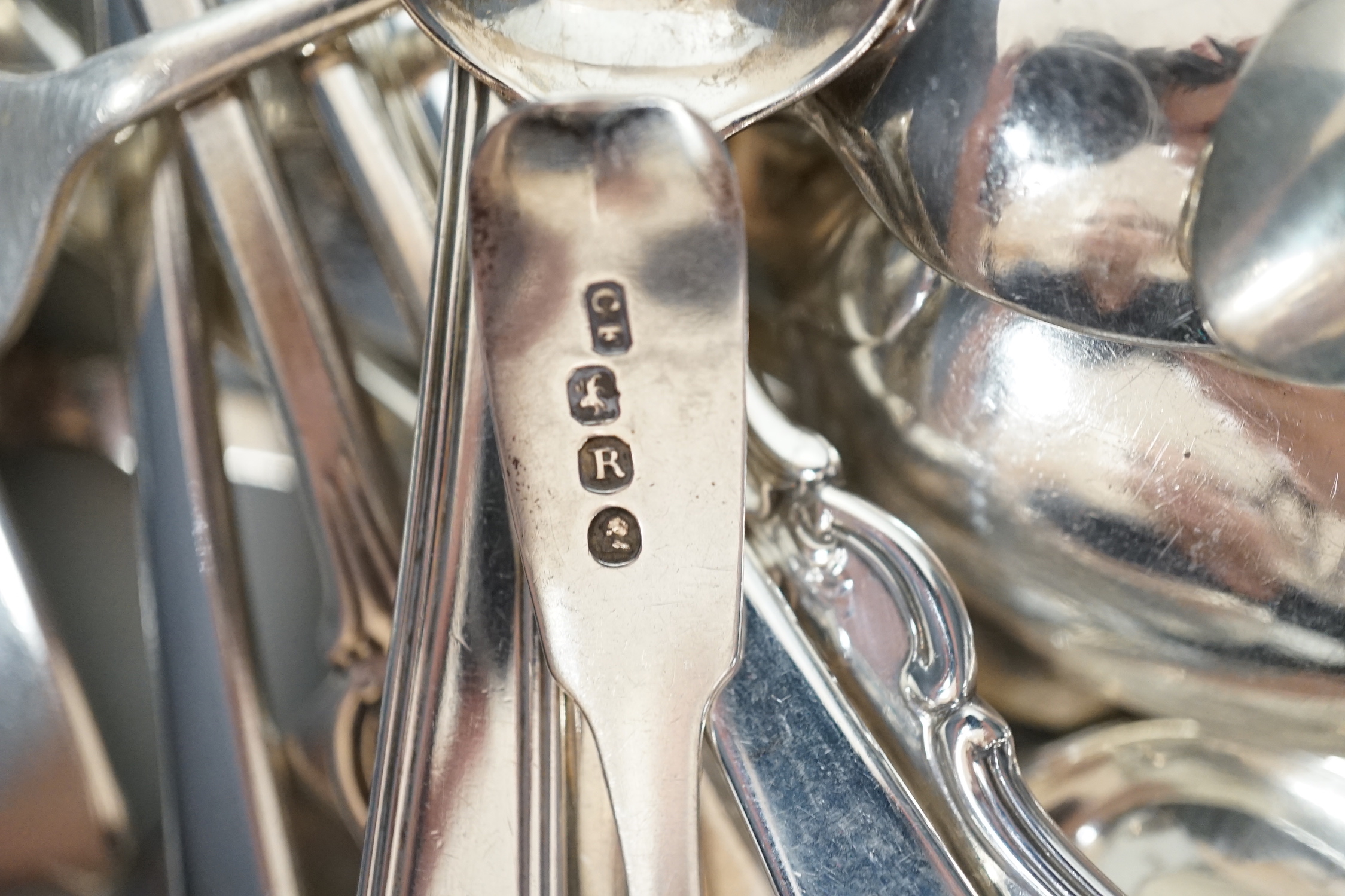 A canteen of mixed George III and later silver flatware, various patterns, dates and makers, 48.6oz.